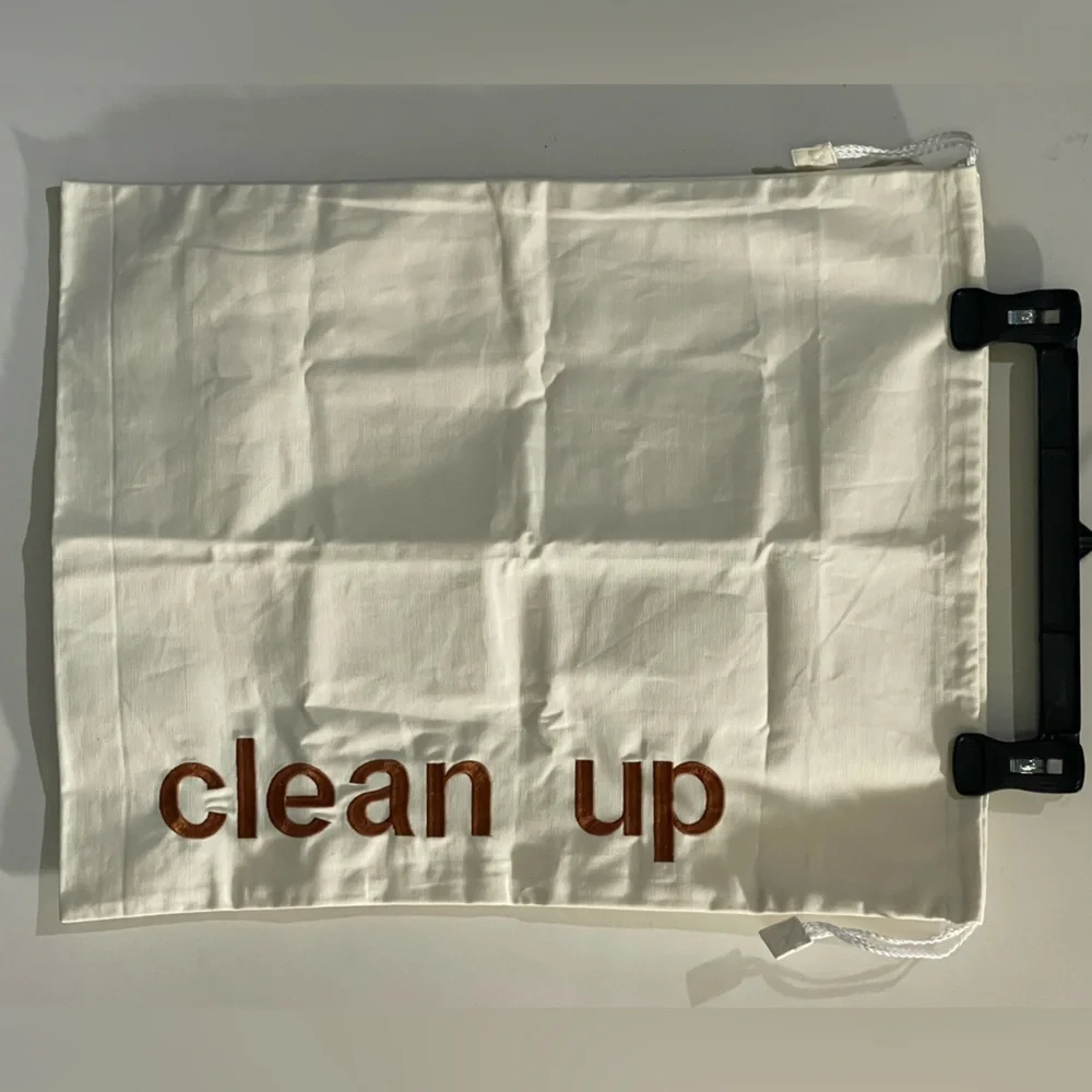 Cream Drawstring Canvas Bag with 'Clean Up' Embroidered Text